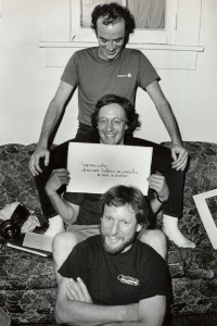 Stanley holding plaque reading "Anyone who doesn't believe in miracles is not a realist!" Photo courtesy of Stanley Greenthal